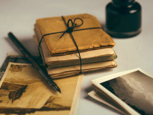 bundle of old photos wrapped in paper