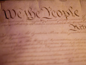closeup photo of "We the People" part of US Constitution